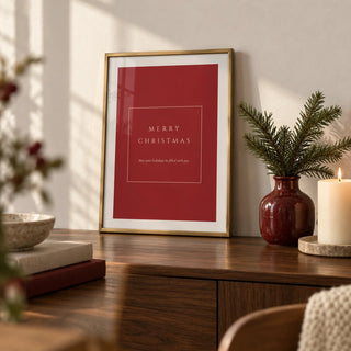 Merry Christmas Poster, a small A4 framed print leaning on a walnut sideboard in a living room