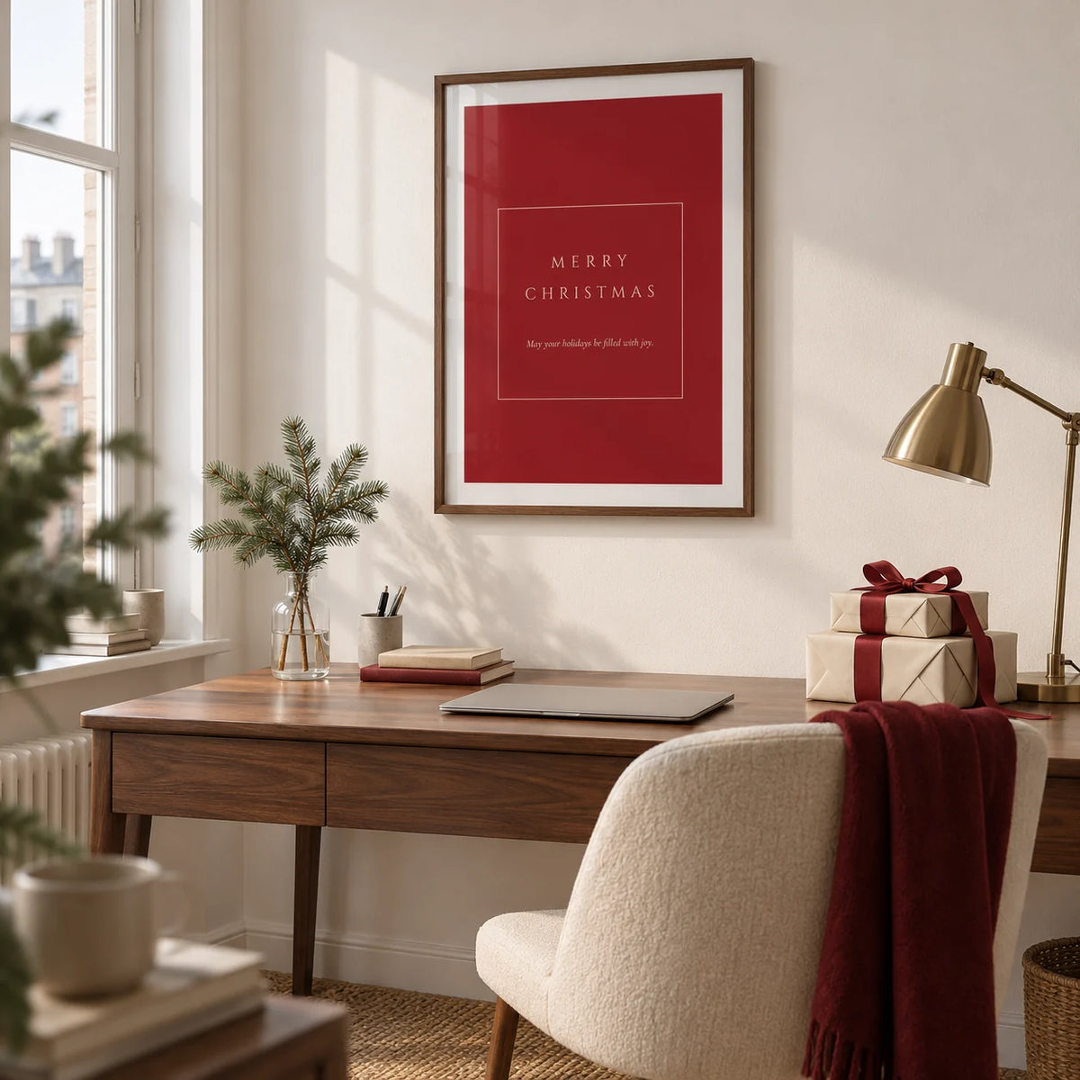 Merry Christmas Poster, framed on the wall of a tidy home study in a UK city flat with a soft white wall and a walnut desk