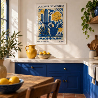 Mexican Folk Art, framed on the wall of a Mexican-modern kitchen with smooth white plaster walls and solid cobalt blue painted cabinets
