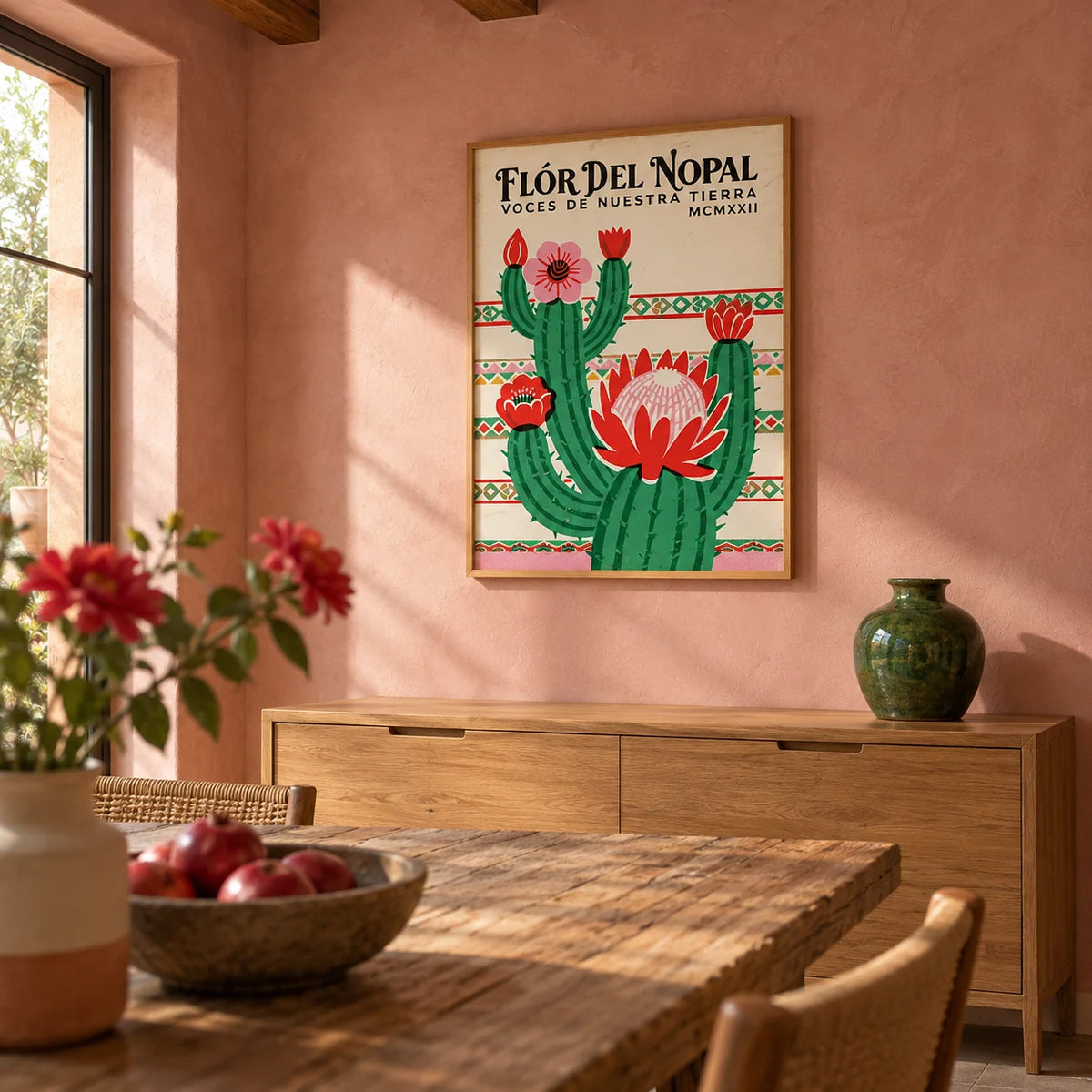 Mexican Folk Art Print, framed on the wall of a Mexican-modern dining room with a dusty pink limewashed wall and wooden ceiling beams