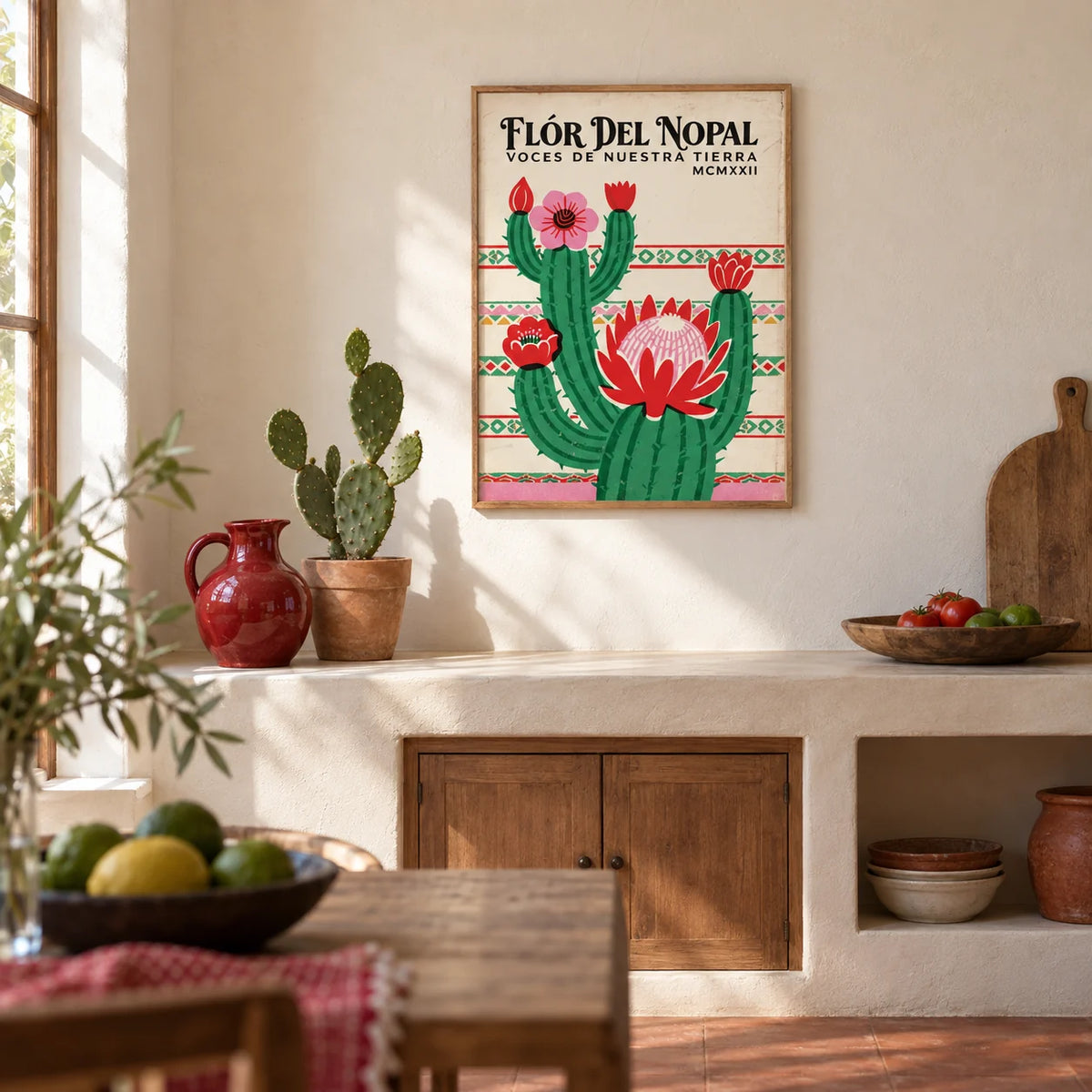 Mexican Folk Art Print, framed on the wall of a Mexican-modern kitchen with smooth warm white plaster walls and a plain terracotta floor