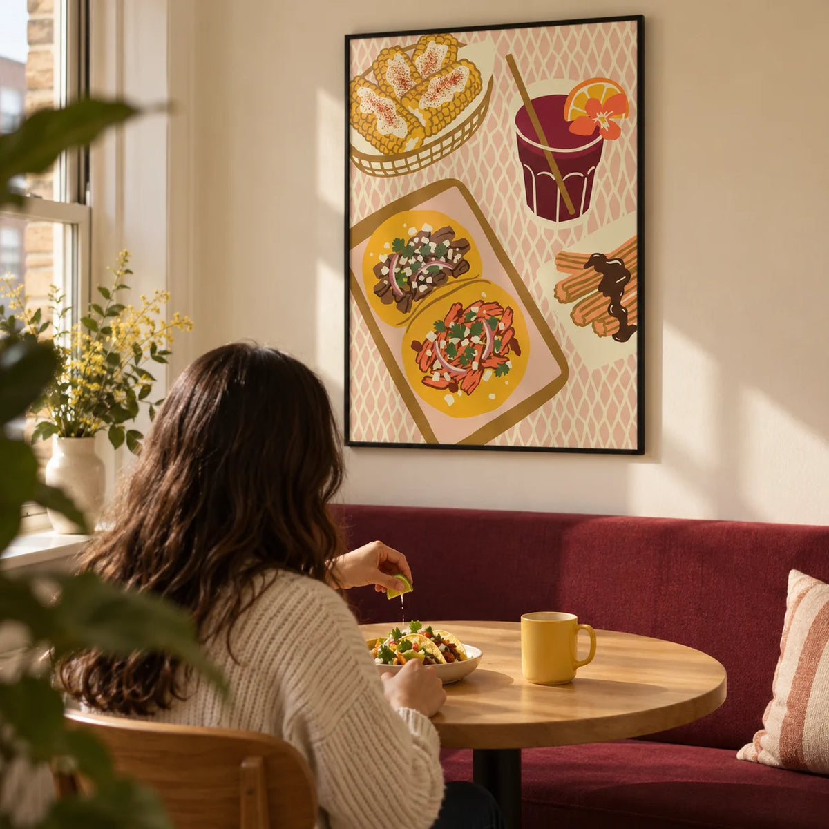 Mexican Food Art Print, framed on the wall of a compact breakfast corner in a modern UK flat with a warm cream wall and a built-in burgundy bench in a kitchen