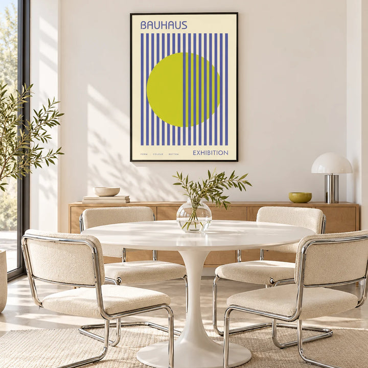 Mid Century Modern Art, framed on the wall of a bright dining room with a white tulip table and chrome chairs