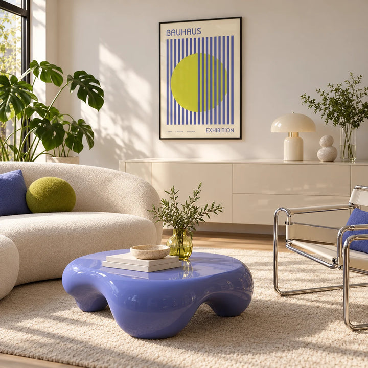 Mid Century Modern Art, framed on the wall of a bright living room with a cream boucle sofa and a periwinkle coffee table