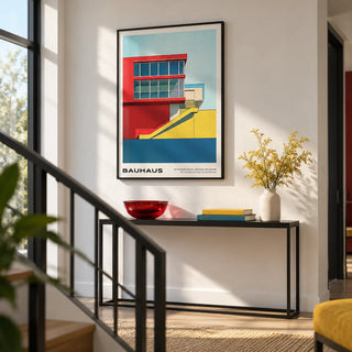 Mid Century Modern Art Prints, framed on the wall of a modern stair landing with a white wall and a black metal balustrade in a hallway