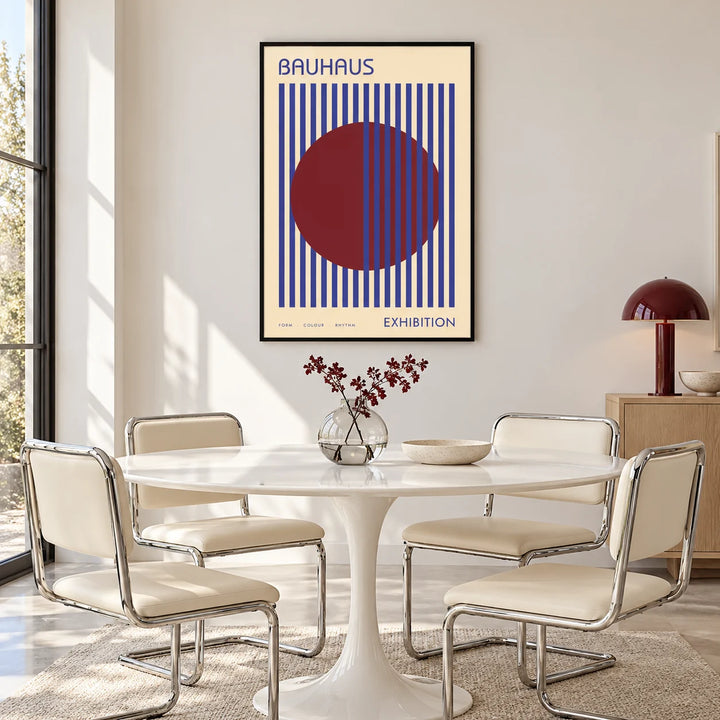 Mid Century Wall Art, framed on the wall of a bright dining room with a white tulip table and a burgundy lamp