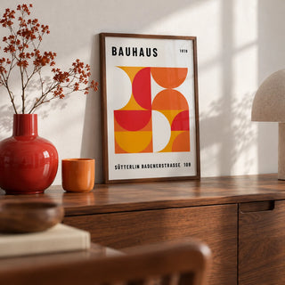 Mid Century Wall Art, a small A4 framed print leaning on a walnut sideboard in a living room