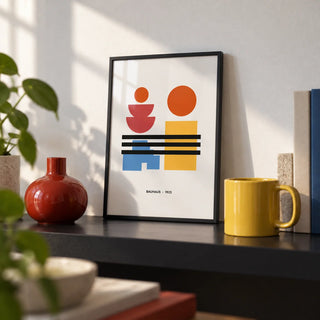 Minamalist Art, a small A4 framed print leaning on a black shelf in a living room