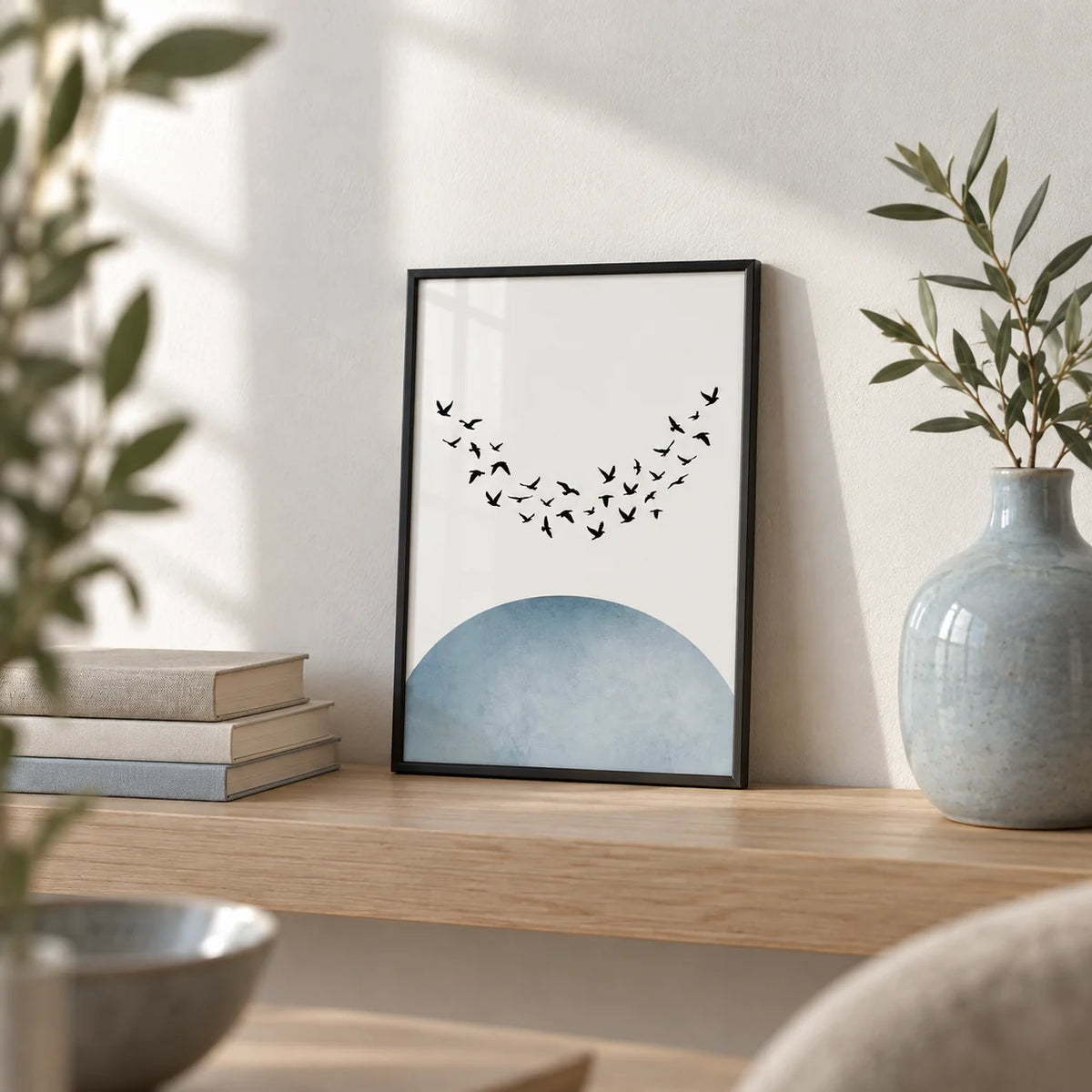 Minimal Wall Decor, a small A4 framed print leaning on a pale oak shelf in a living room