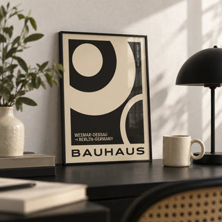 Minimalist Abstract Art Prints, a small A4 framed print leaning on a black desk
