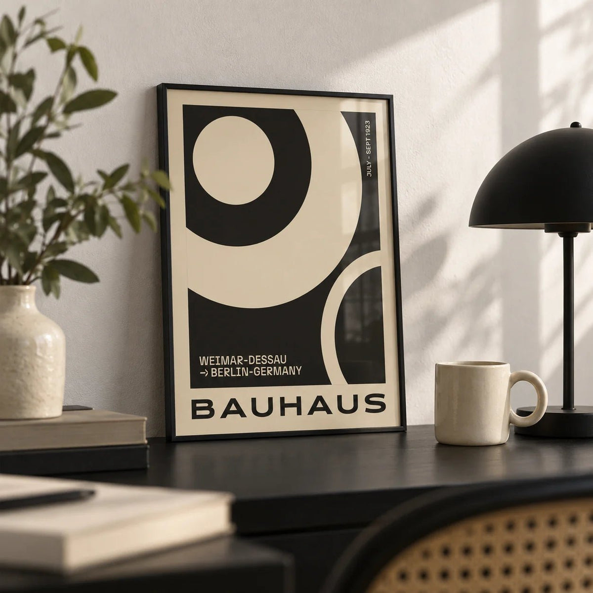 Minimalist Abstract Art Prints, a small A4 framed print leaning on a black desk