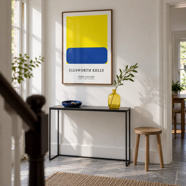 Minimalist Artwork, framed on the wall of a bright entrance hallway in a renovated UK maisonette with white plaster walls and a grey stone floor
