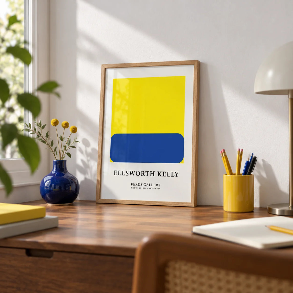 Minimalist Artwork, a small A4 framed print leaning on a walnut writing desk