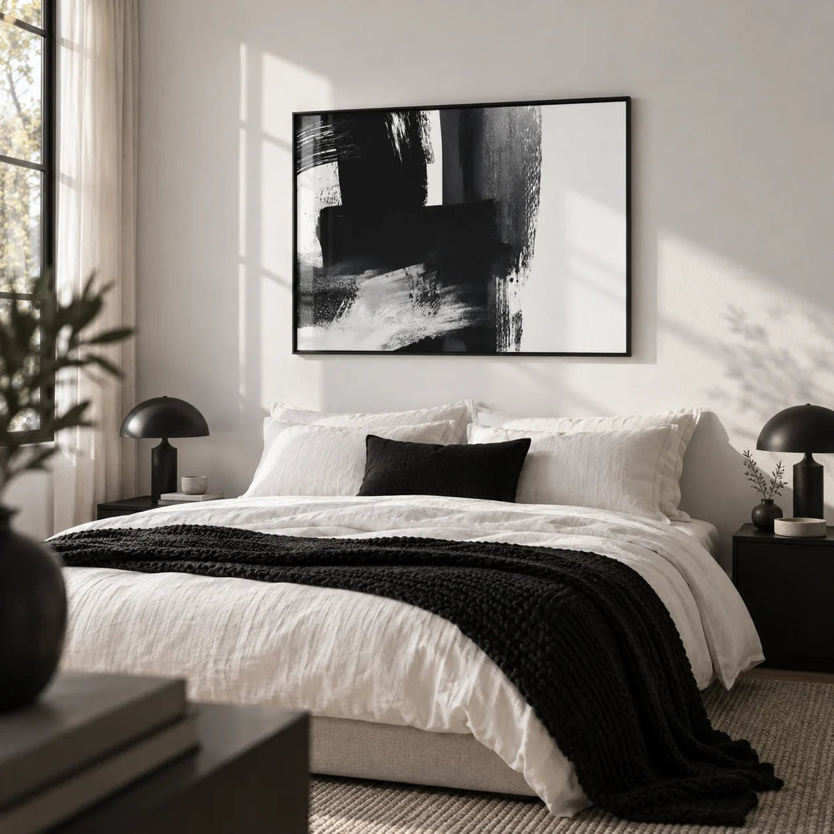 Minimalist Black And White Print, framed on the wall of a calm monochrome bedroom with a white wall