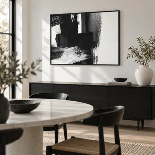 Minimalist Black And White Print, framed on the wall of a modern dining room with a white wall