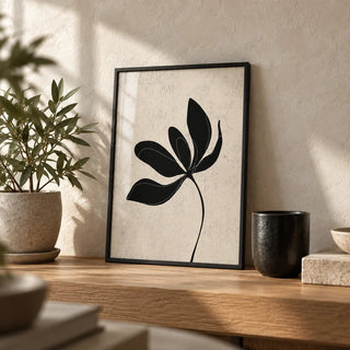 Minimalist Botanical Wall Art, a small A4 framed print leaning on an oak shelf in a living room