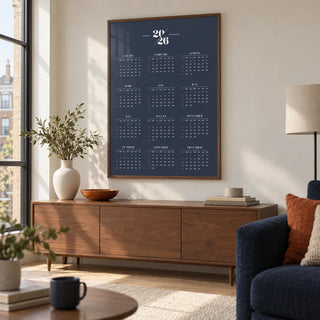 Minimalist Calendar, framed on the wall of a contemporary living room in a UK city flat with warm white walls and a pale oak floor