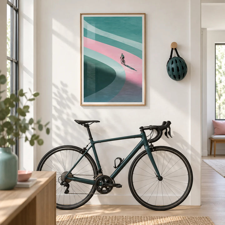 Minimalist Cycling Art Print, framed on the wall of a bright modern hallway with a white wall and pale oak floor
