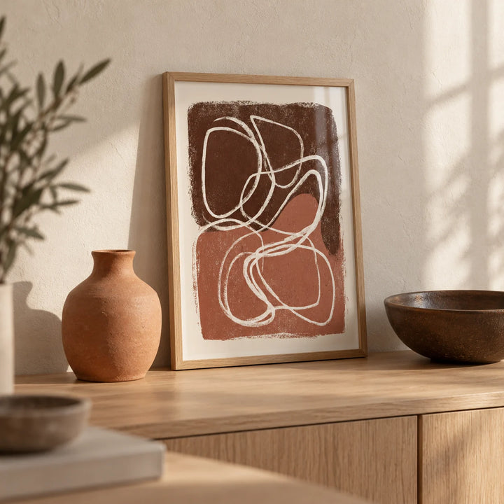 Minimalist Shapes Wall Art, a small A4 framed print leaning on a pale oak sideboard in a living room