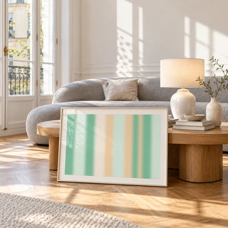 Mint Green Wall Art, framed and leaning against a coffee table in a bright living room