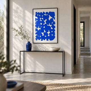 Modern Abstract Art, framed on the wall of a modern hallway with white walls and a pale concrete floor