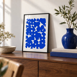 Modern Abstract Art, a small A4 framed print leaning on a walnut sideboard in a living room