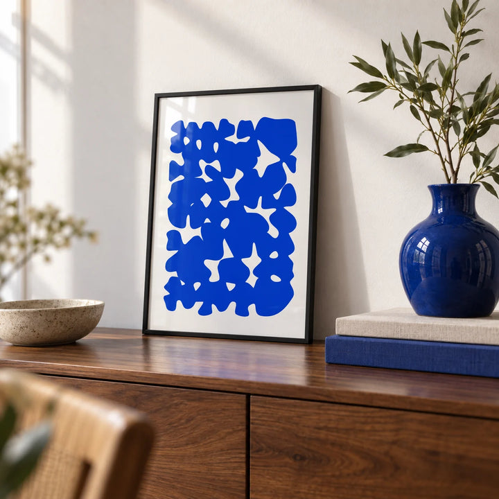 Modern Abstract Art, a small A4 framed print leaning on a walnut sideboard in a living room