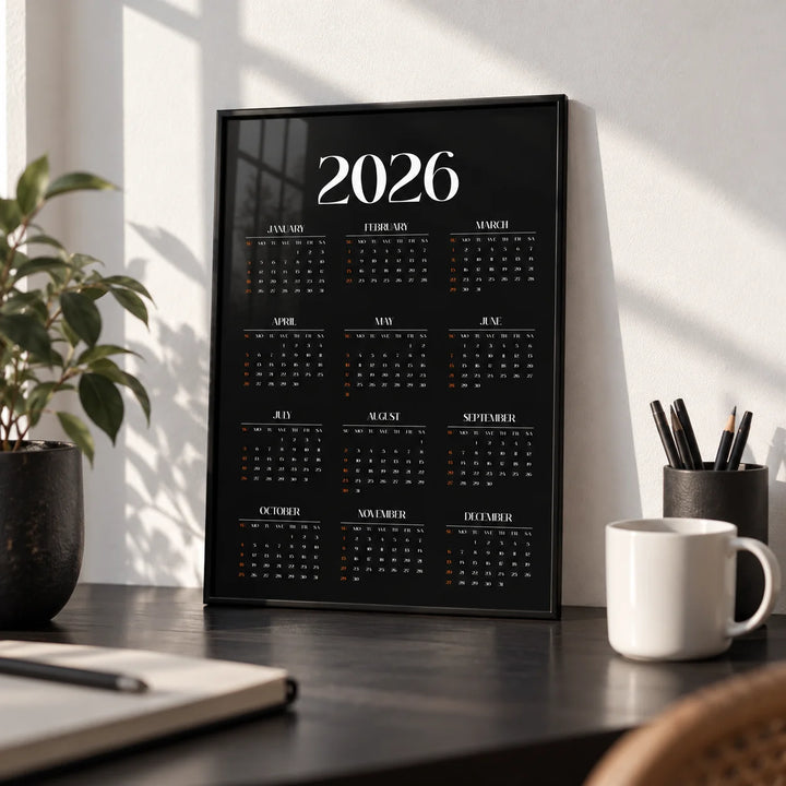 Modern Calendar Print, a small A4 framed print leaning on a black desk