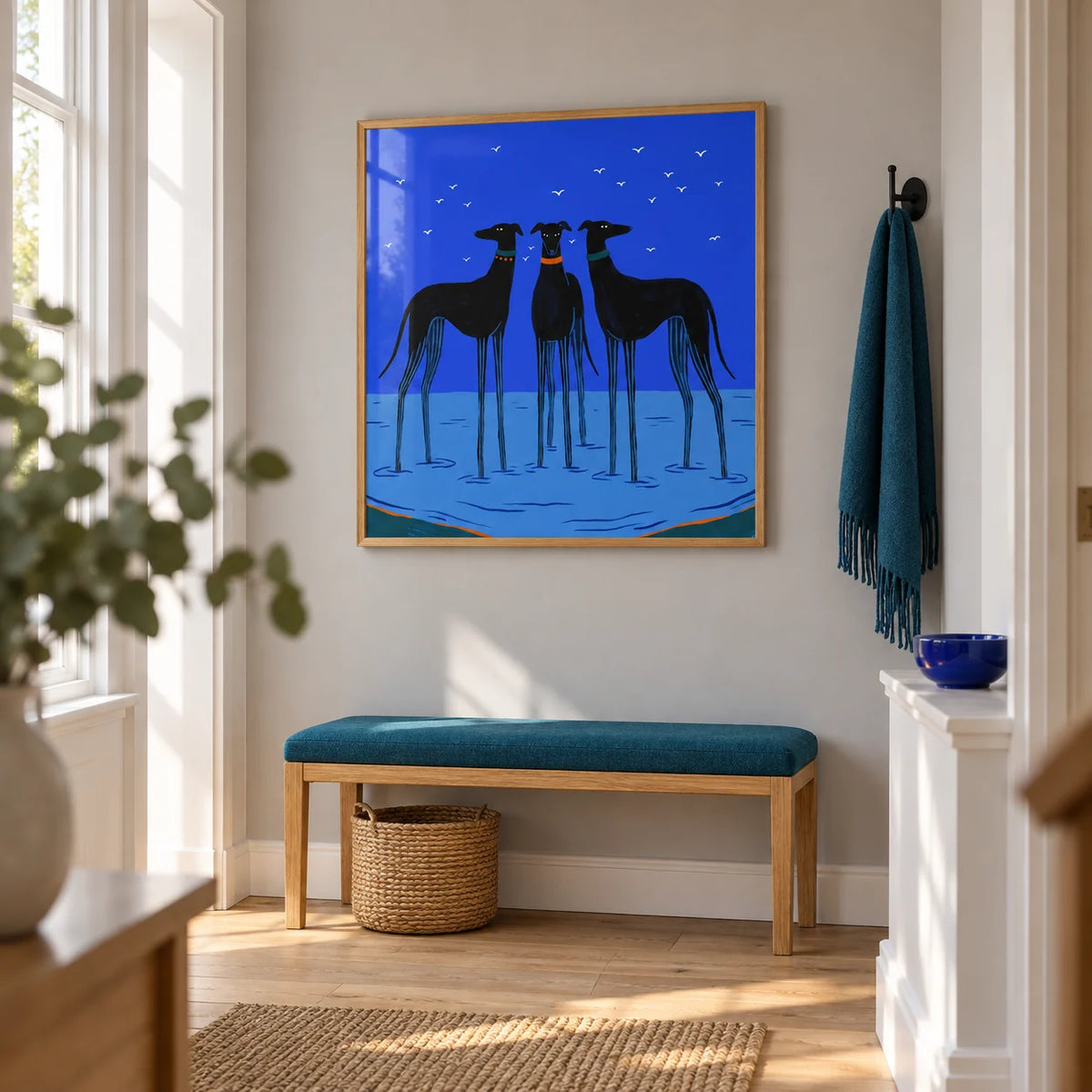 Modern Dog Wall Art, framed on the wall of a bright hallway in a renovated terraced house with a pale grey wall and simple timber flooring