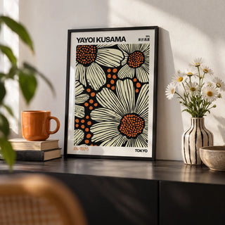 Modern Floral Art Print, a small A4 framed print leaning on a black shelf in a living room
