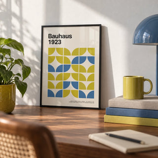 Bauhaus Geometric Art, a small A4 framed print leaning on a walnut desk