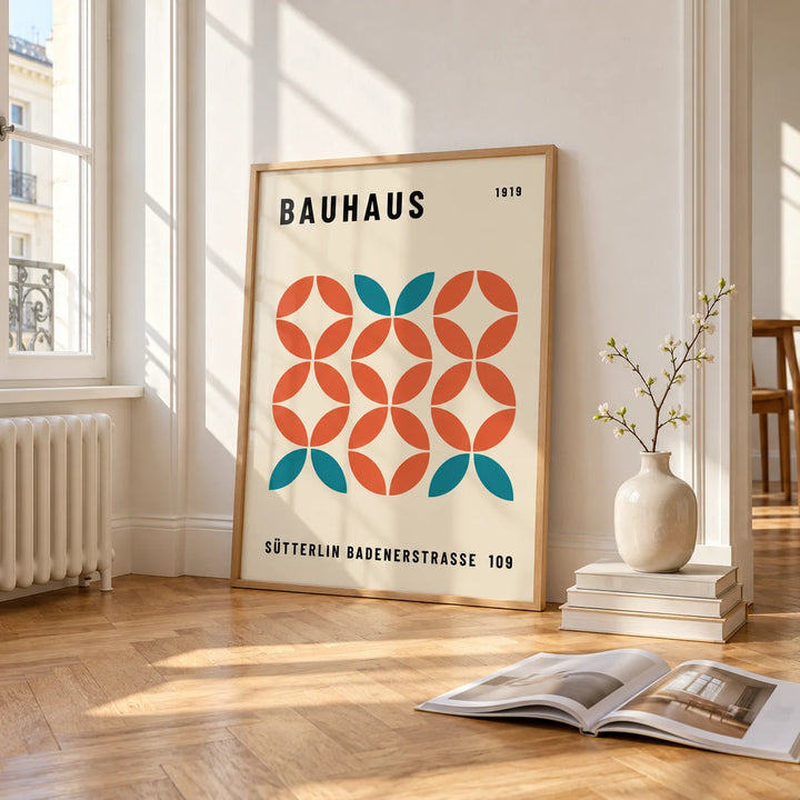 Modern Geometric Wall Art, framed and leaning on the parquet floor of a bright living room