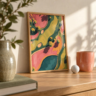 Modern Golf Aerial Poster, a small A4 framed print leaning on an oak shelf in a living room