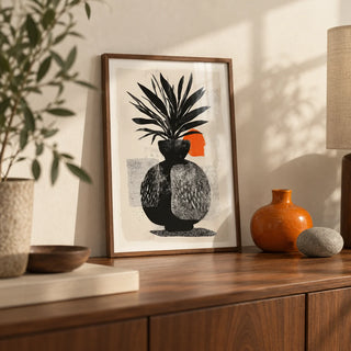 Modern Indian Sun Plant Wall Art, a small A4 framed print leaning on a walnut sideboard in a living room