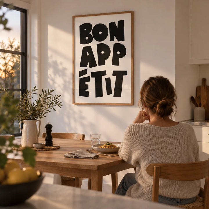 French Art Prints, framed on the wall of a bright kitchen-diner with a white wall