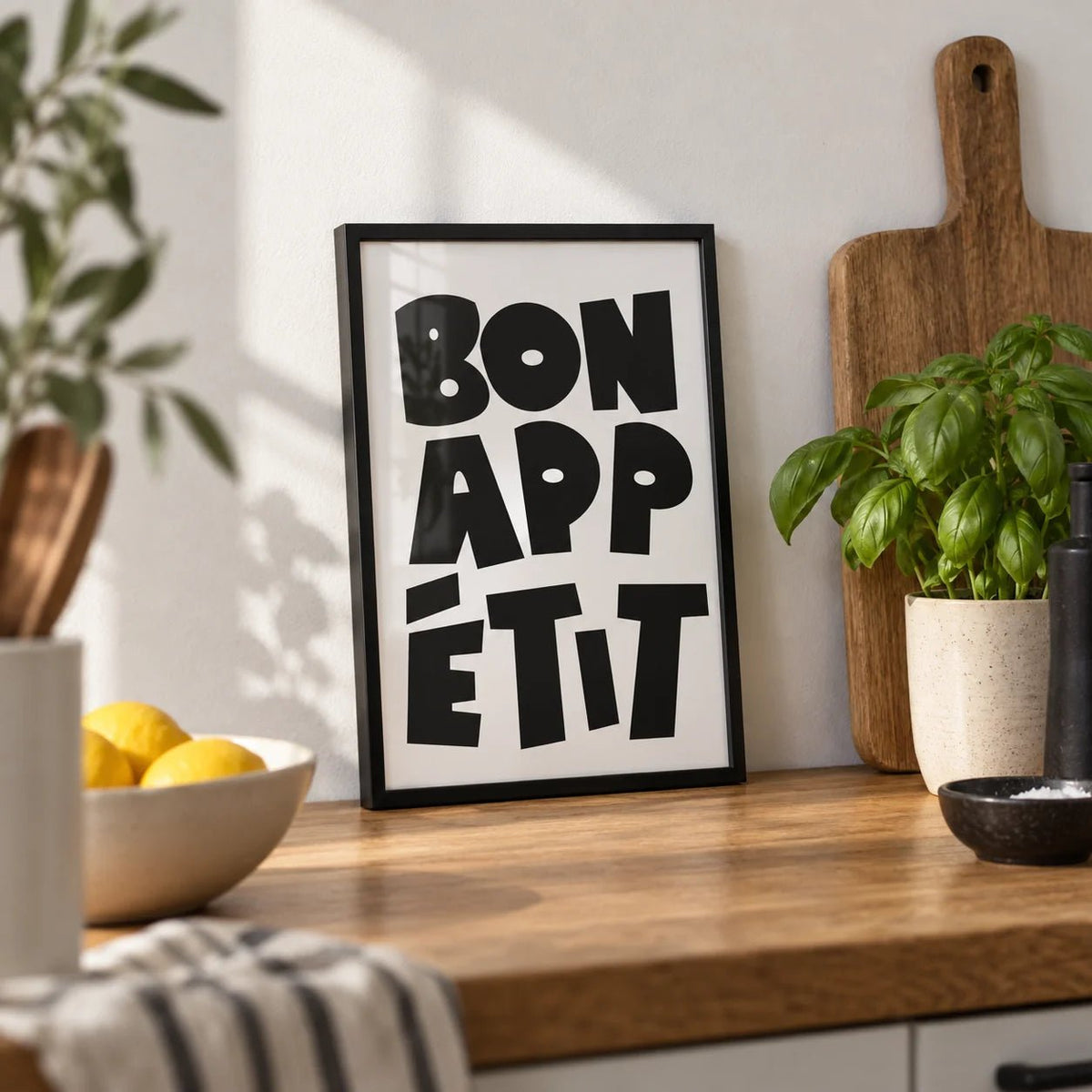 French Art Prints, a small A4 framed print leaning on an oak kitchen worktop