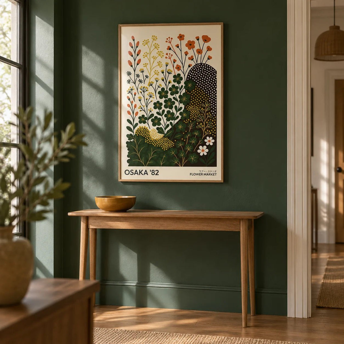 Modern Nature Wall Art Print, framed on the wall of a hallway with a forest green painted wall