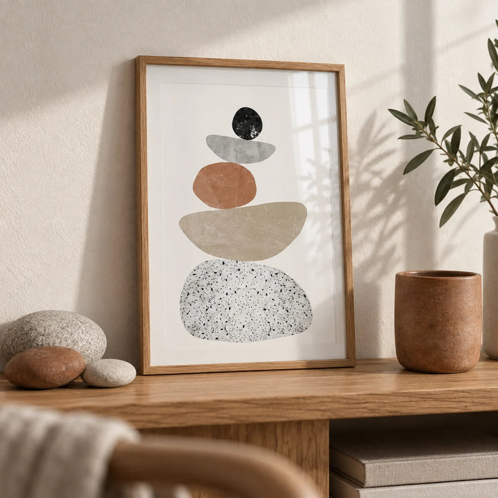 Modern Pebble Print, a small A4 framed print leaning on an oak shelf in a living room