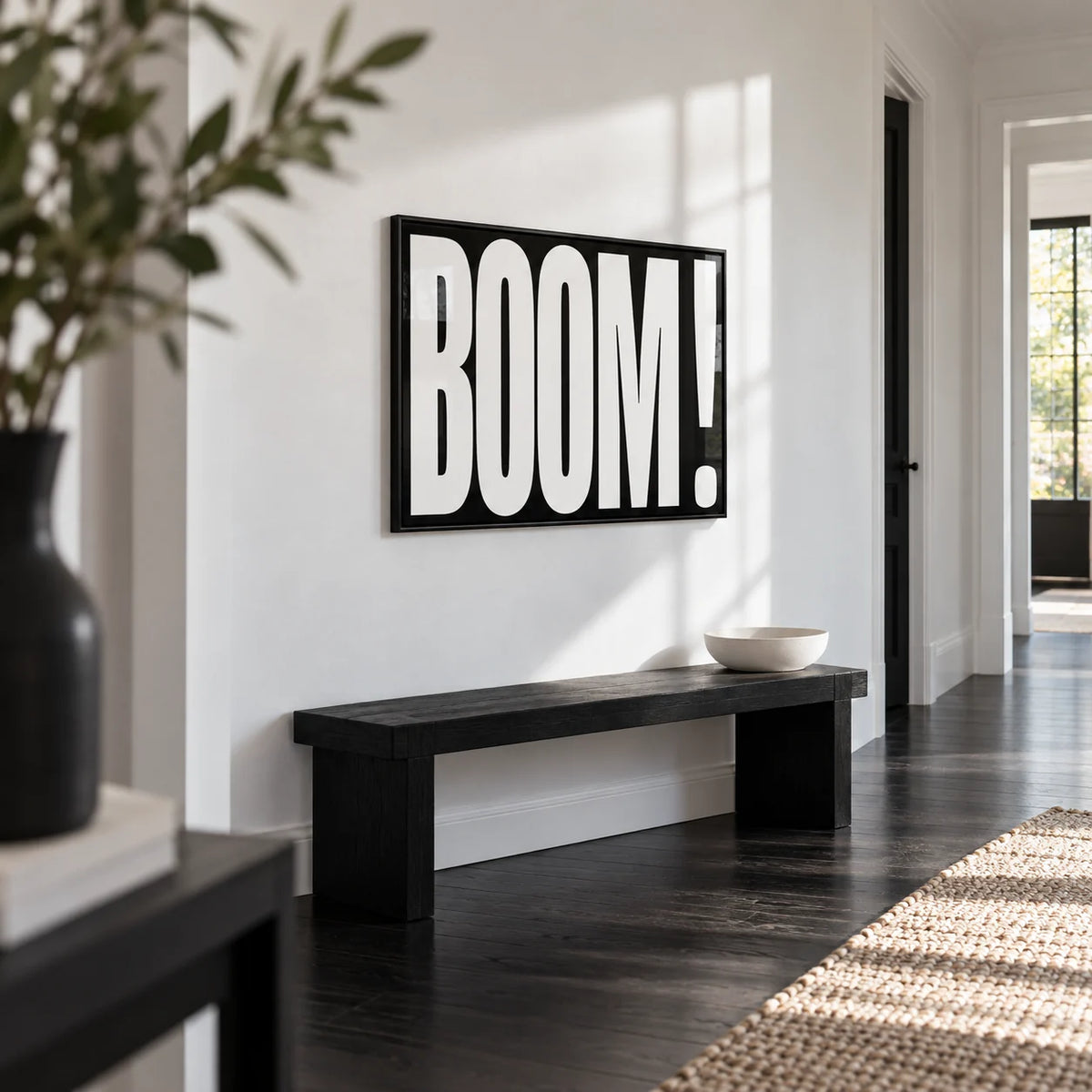 Modern Typography Wall Art, framed on the wall of a crisp white hallway with a black floor