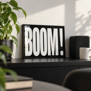 Modern Typography Wall Art, a small A4 framed print leaning on a black shelf in a living room