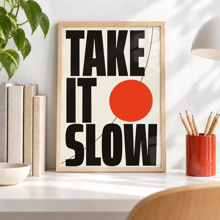 Modern Typography Wall Art, a small A4 framed print leaning on a white desk