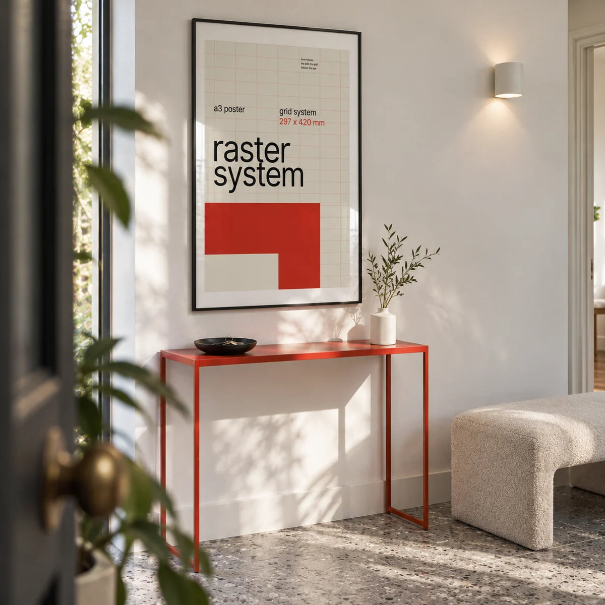 Modernist Wall Art, framed on the wall of a bright entrance hallway in a design-conscious UK flat with a white wall and grey terrazzo floor