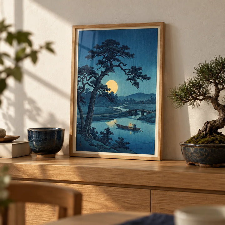 Moonlight Print, a small A4 framed print leaning on an oak shelf in a living room
