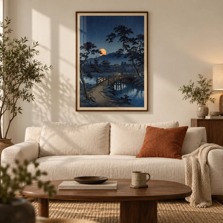 Moonlit Bridge Art Print, framed on the wall of a calm modern living room with a warm white wall and a walnut floor