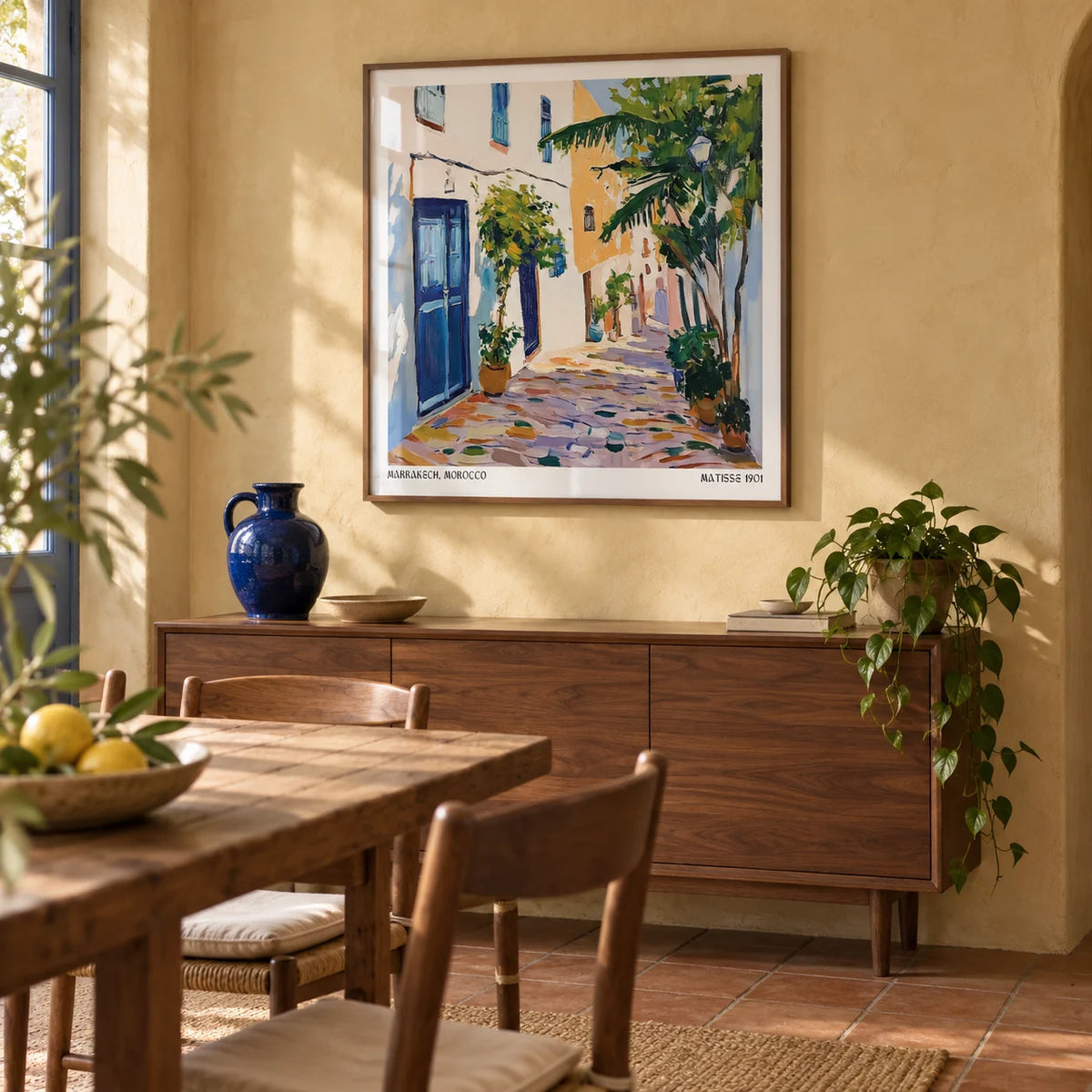 Morocco Wall Art, framed on the wall of a characterful dining room with pale ochre plaster walls and plain terracotta floor tiles