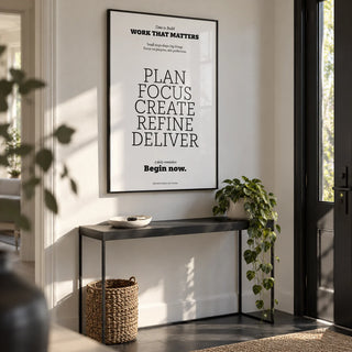 Motivate Quote Poster, framed on the wall of a modern hallway by the front door with a white wall and a dark grey floor