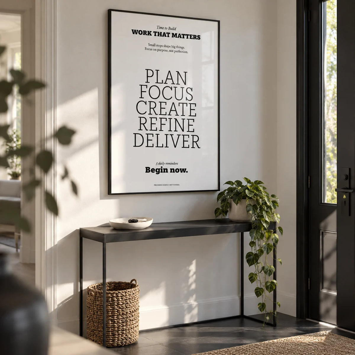 Motivate Quote Poster, framed on the wall of a modern hallway by the front door with a white wall and a dark grey floor