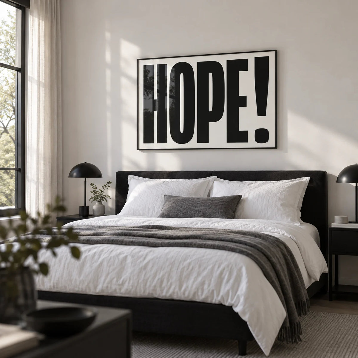 Motivational Work Posters, framed on the wall of a calm monochrome bedroom with a white wall