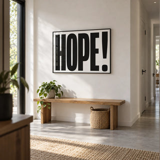 Motivational Work Posters, framed on the wall of a modern hallway with a white wall and a pale grey floor