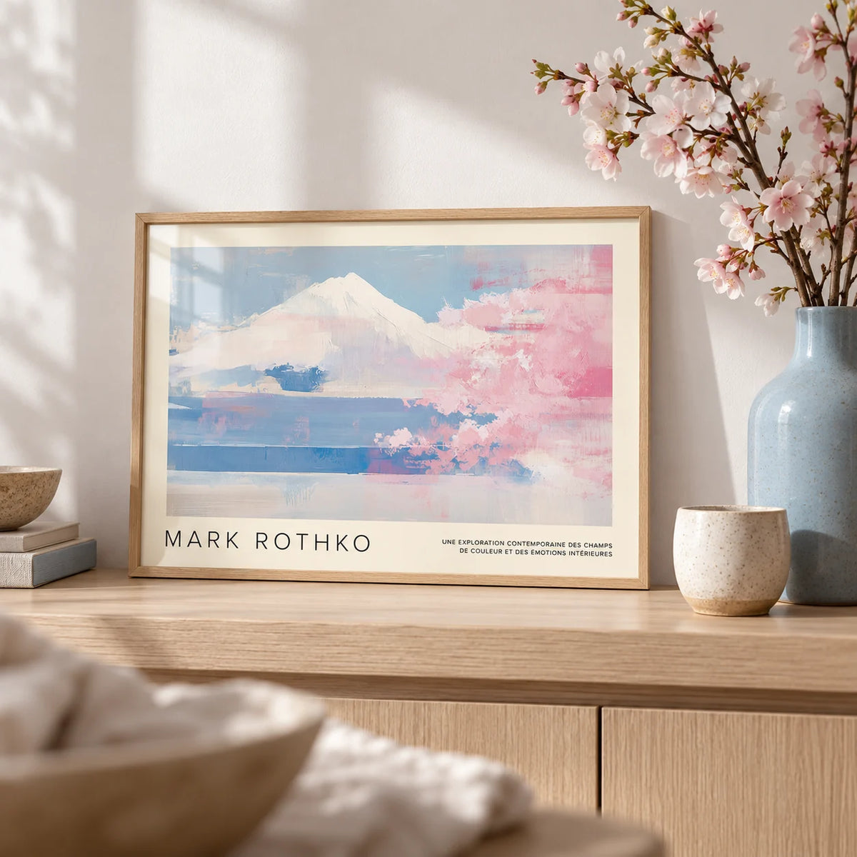 Mountain Landscape Wall Art, a small A4 framed print leaning on a pale oak shelf in a living room